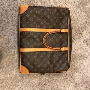Louis vuitton briefcase with small lock and key.